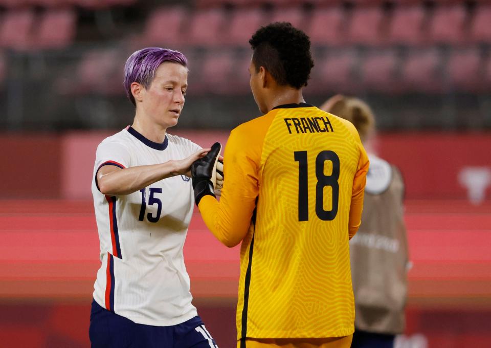 Forward Megan Rapinoe and goalkeeper Adrianna Franch react after the USWNT's semifinal loss to Canada.