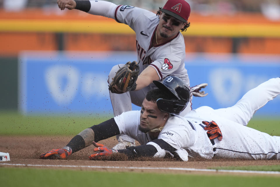 Detroit Tigers' Javier Baez is tagged out at third during the first inning of a baseball game against the Arizona Diamondbacks, Friday, June 9, 2023, in Detroit. (AP Photo/Carlos Osorio)