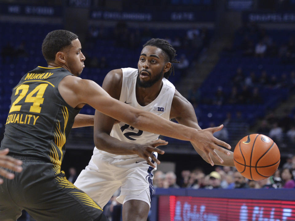 Penn State's Evan Mahaffey passes around Iowa's Kris Murray (24) during the first half of an NCAA college basketball game, Sunday, Jan. 1, 2023, in State College, Pa. (AP Photo/Gary M. Baranec)