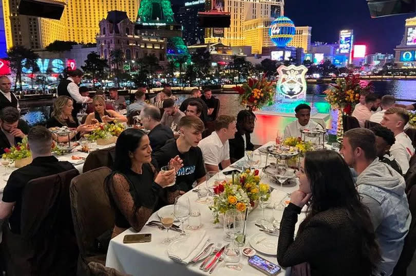 Spago restaurant owner Tom Kaplan posted this shot of the Wrexham squad with the caption: "Spago welcomed the entire Wrexham football club with Rob McElhenney on their victory tour!" McElhenney can be seen on the left-hand table with his wife, Kaitlin Olson, opposite him. -Credit:Twitter/Tom Kaplan