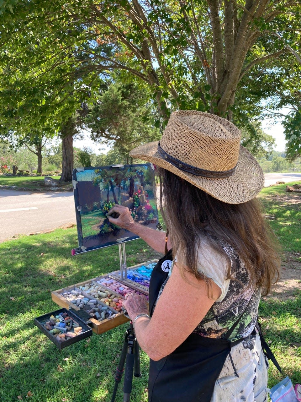 Women Artists of the West member Jude Tolar works during last year's spring plein air event at Woolaroc Museum and Wildlife Preserve.
