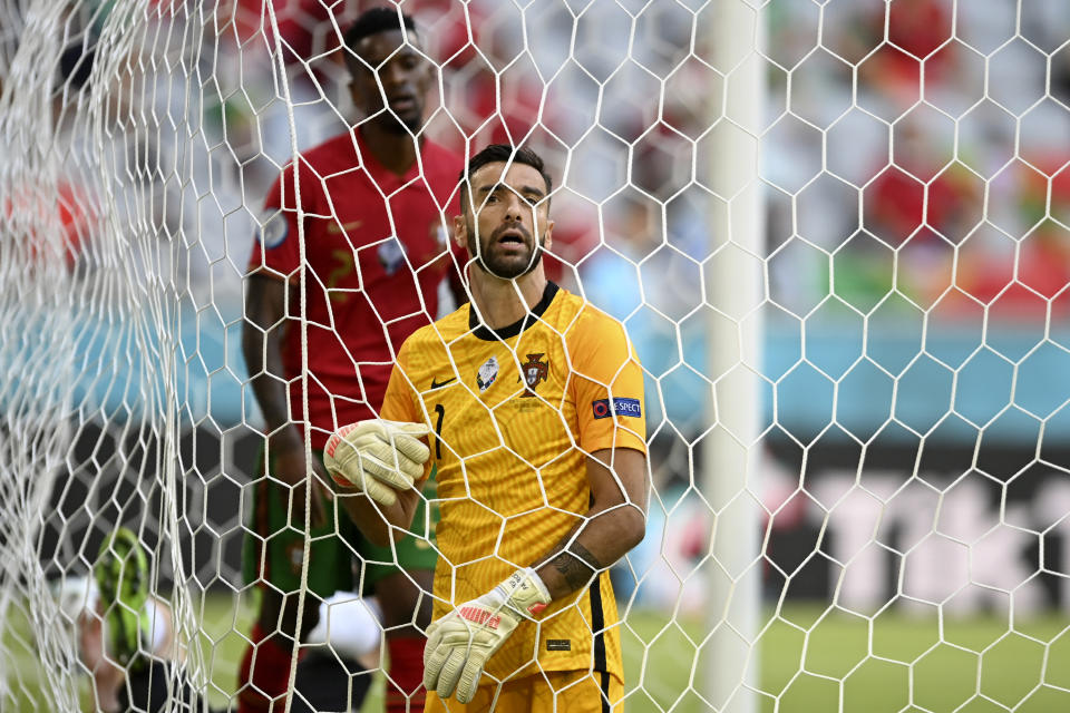 Portugal's goalkeeper Rui Patricio reacts after Germany scored their fourth goal during the Euro 2020 soccer championship group F match between Portugal and Germany at the Football Arena stadium in Munich, Germany, Saturday, June 19, 2021. (Philipp Guelland/Pool via AP)