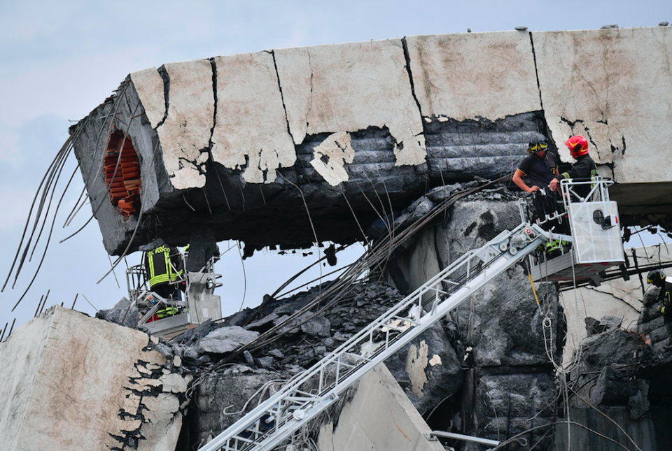 <em>Four people have so far been pulled out of the rubble alive (AP)</em>