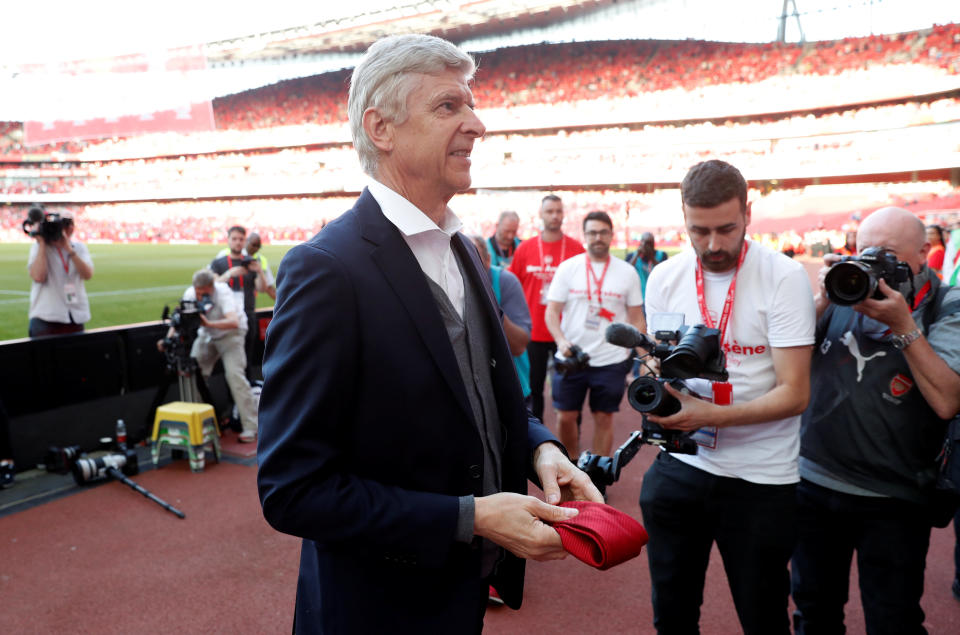 <p>Soccer Football – Premier League – Arsenal vs Burnley – Emirates Stadium, London, Britain – May 6, 2018 Arsenal manager Arsene Wenger takes his tie off to hand to a young fan during the lap of honour after the match Action Images via Reuters/Matthew Childs EDITORIAL USE ONLY. No use with unauthorized audio, video, data, fixture lists, club/league logos or “live” services. Online in-match use limited to 75 images, no video emulation. No use in betting, games or single club/league/player publications. Please contact your account representative for further details. </p>