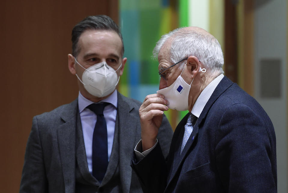 European Union foreign policy chief Josep Borrell, right, speaks to Germany's Foreign Minister Heiko Maas during a EU Foreign Affairs Ministers meeting at the European Council building in Brussels, Monday, Jan. 25, 2021. The European Union called Monday for broad political talks in Venezuela to set up new elections and warned that it stands ready to slap sanctions on more senior officials in the country for undermining democracy or human rights violations. (John Thys/Pool Photo via AP)