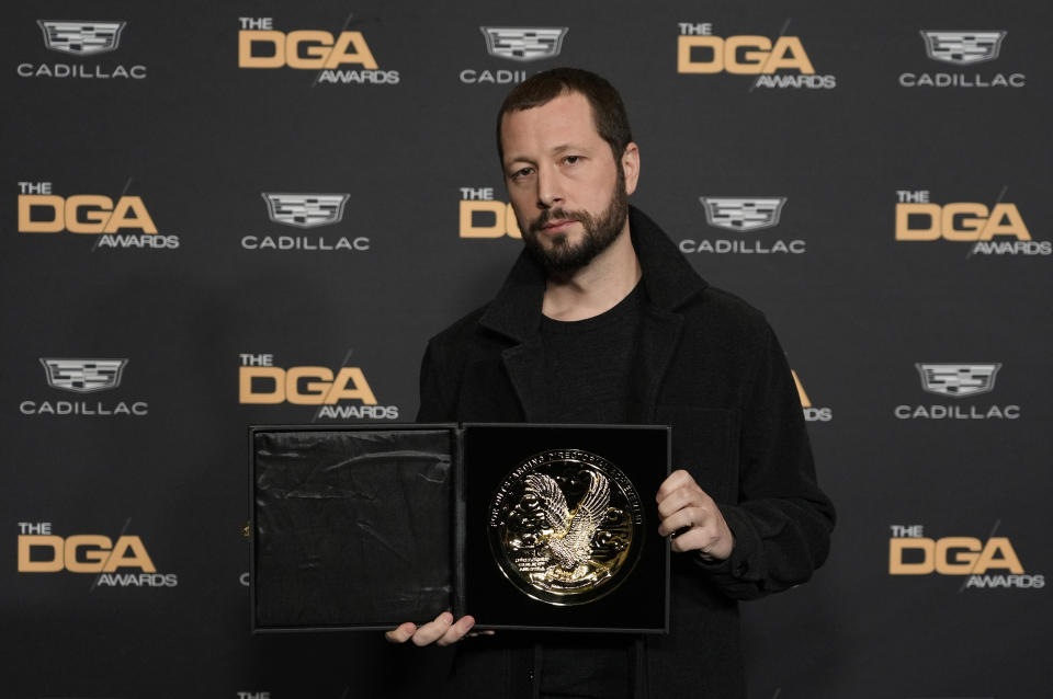 Mstyslav Chernov, director of the documentary film "20 Days in Mariupol," holds his DGA Award for Documentary backstage at the 76th DGA Awards, Saturday, Feb. 10, 2024, in Beverly Hills, Calif. (AP Photo/Chris Pizzello)