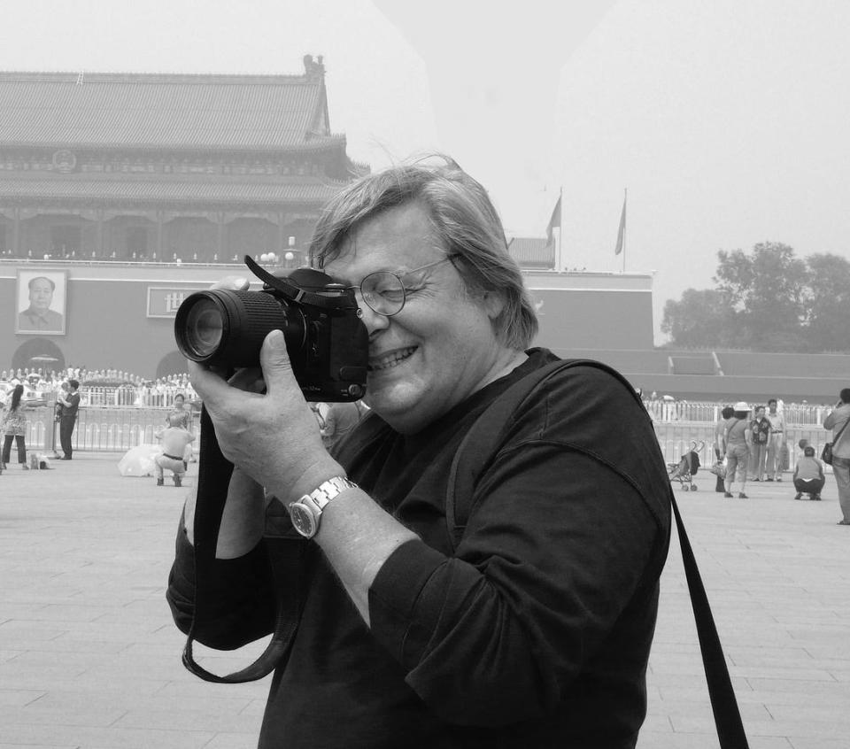 Rowland Scherman, who has traveled the world photographing culture and history, in Beijing. He has a show of  his works opening in Falmouth.