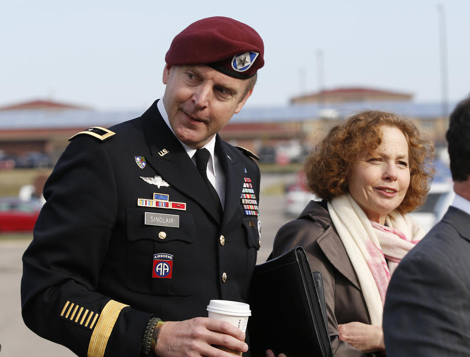 Brig. Gen. Jeffrey Sinclair, left, who admitted to inappropriate relationships with three subordinates, arrives at the courthouse with attorney Ellen Brotman, right, for sentencing at Fort Bragg, N.C., Thursday, March 20, 2014. Sinclair was reprimanded and docked $20,000 in pay Thursday, avoiding jail time in one of the U.S. military's most closely watched courts-martial.(AP Photo/Ellen Ozier)