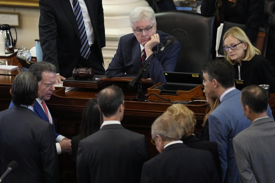 Texas Lt. Gov. Dan Patrick, center, and legal counsel Lana Myers, right, listen to defense and prosecution attorneys during the impeachment trial for Texas Attorney General Ken Paxton in the Senate Chamber at the Texas Capitol, Wednesday, Sept. 13, 2023, in Austin, Texas. (AP Photo/Eric Gay)