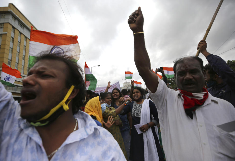 Indian farmers and activists shout anti-government slogans during a protest against farm bills in Bengaluru, India, Monday, Sept. 21, 2020. (AP Photo/Aijaz Rahi)