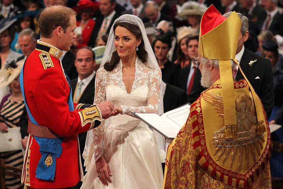 Prince William places a ring on Kate Middleton's finger