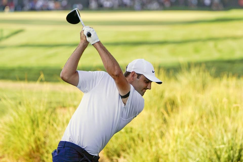 Scottie Scheffler, the world's No. 1-ranked player, tees off No. 18 at Bay Hill in last year's Arnold Palmer Invitational.