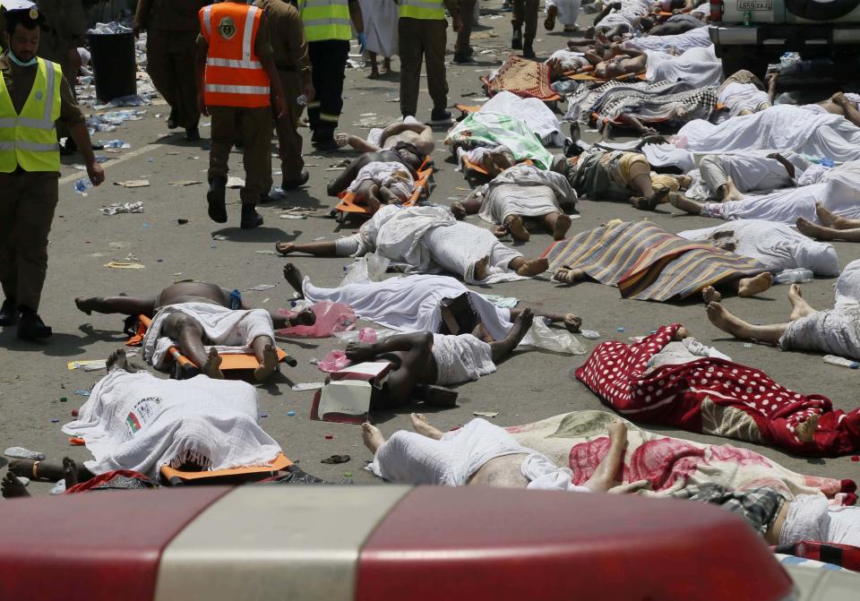 FILE - In this Sept. 24, 2015, file photo, bodies of people who died in a crush in Mina, Saudi Arabia during the annual hajj pilgrimage lie in a street. An Associated Press count in 2015 found that 2, 411 Muslim pilgrims died at Mina, three times the number of deaths acknowledged by the kingdom. There has not been a public investigation, nor accountability and Saudi Arabia rebuffed criticism from Iran and efforts by other countries to join a probe into the deaths. (AP Photo/File)