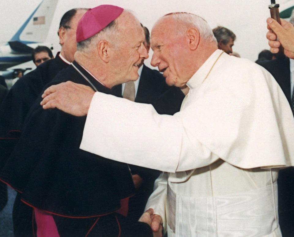 Then-Archbishop Theodore McCarrick, left, is seen with Pope John Paul II in Newark, N.J., in this October 1995 file photo. McCarrick was named cardinal  Jan. 21, 2001. (AP Photo/Arturo Mari)