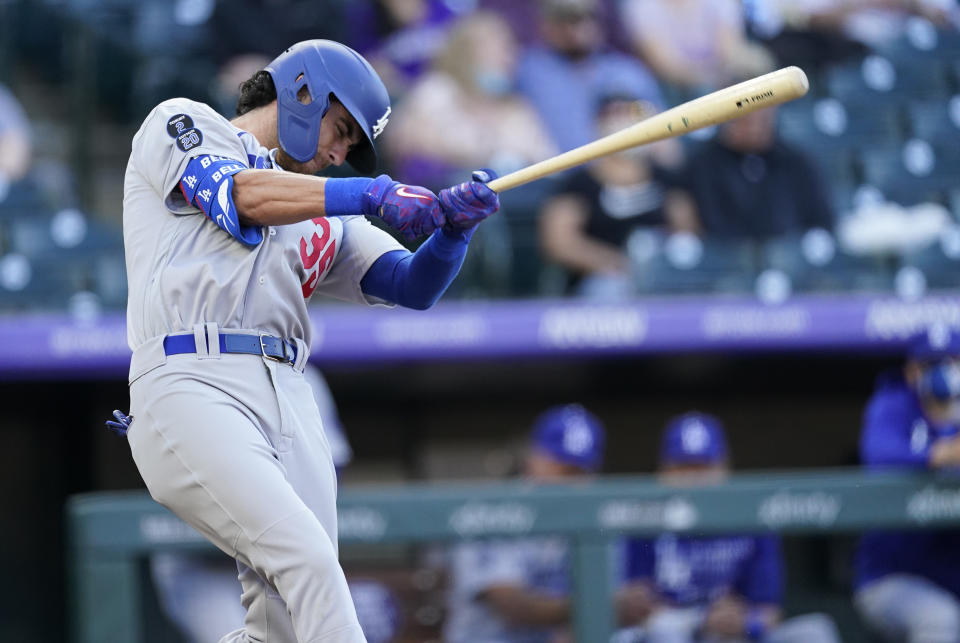 Los Angeles Dodgers' Cody Bellinger fouls off a pitch from Colorado Rockies starter Jon Gray in the first inning of a baseball game Saturday, April 3, 2021, in Denver. (AP Photo/David Zalubowski)