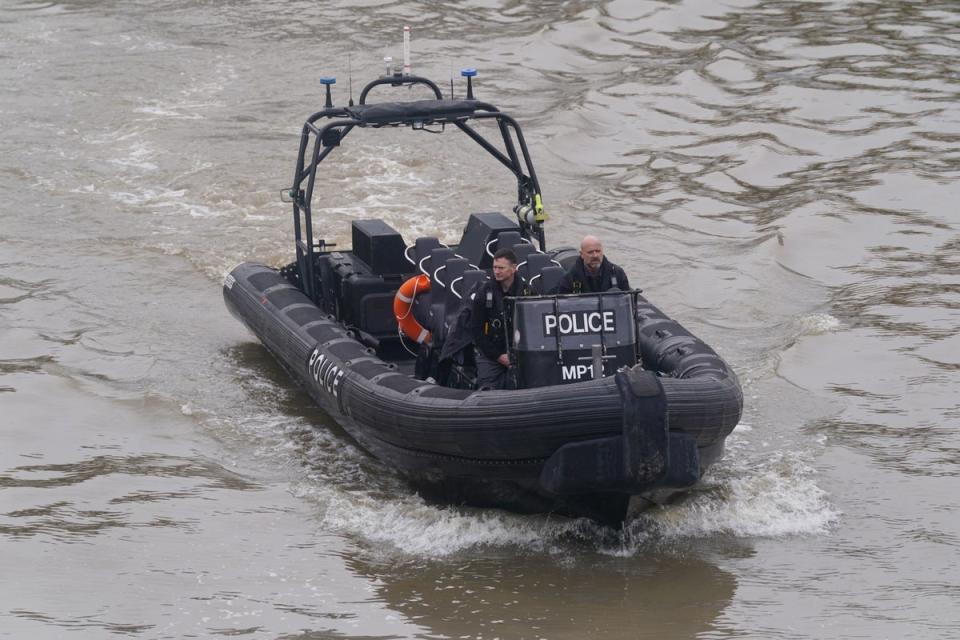 The Met’s marine policing unit searching for Ezedi near Chelsea Bridge (PA)