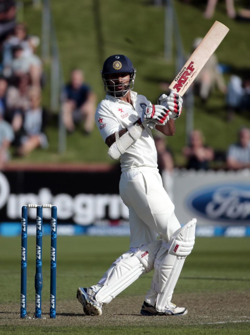 India's Shikhar Dhawan plays a shot against New Zealand during the first innings on day one of the second international test cricket match at the Basin Reserve in Wellington, February 14, 2014.