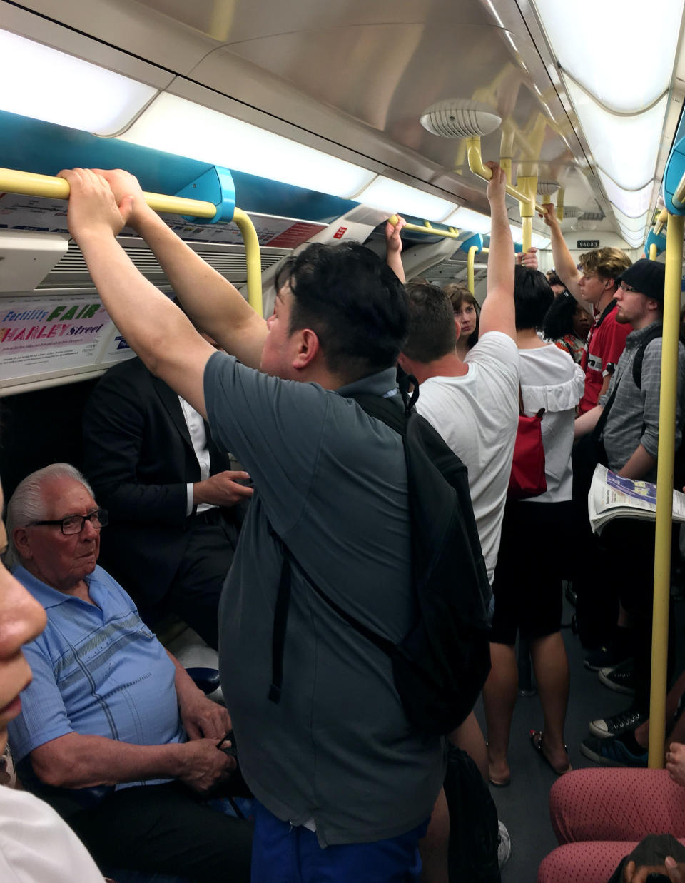 Hot commuters on a busy Jubilee Line tube in London as the Met Office has issued the second highest heatwave alert for all of Britain as the country endures some extreme heat.