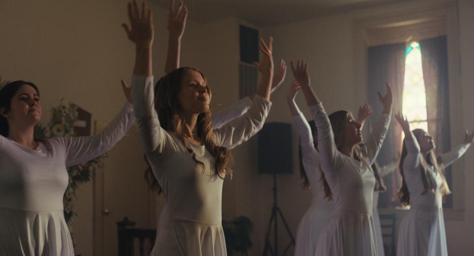 Eliza Scanlen (center) is a Kentucky teenager growing up in a devout Christian community in the drama "The Starling Girl."