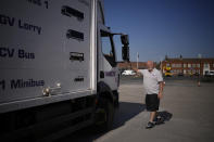 Instructor Graham Bolger directs learner truck driver Cadhene Lubin-Hewitt as he reverses a truck at the National Driving Centre in Croydon, south London, Wednesday, Sept. 22, 2021. Lubin-Hewitt, 32, moved to the UK when he was 16 from Trinidad and Tobago and has been driving buses and coaches for about 10 years. Britain doesn't have enough truck drivers. The shortage is contributing to scarcity of everything from McDonald's milkshakes to supermarket produce. (AP Photo/Matt Dunham)