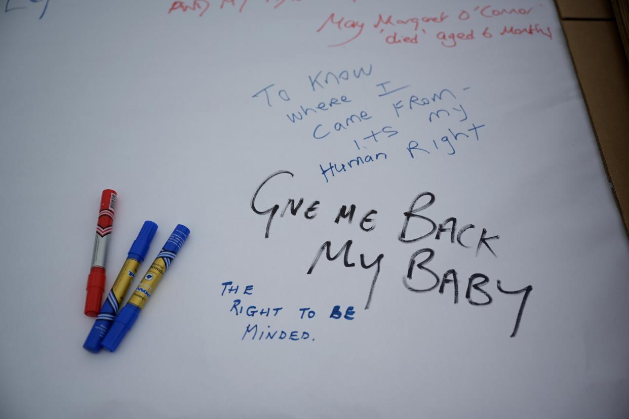 TUAM, IRELAND - AUGUST 25: Messages are left as a vigil is held at the Tuam Mother and Baby home mass burial site on August 25, 2019 in Tuam, Ireland. Nearly 800 babies and young children who died in the Tuam Home run by the Bon Secours order of nuns for unmarried mothers are buried there in unmarked graves. The vigil was held to highlight the government's delay in progressing legislation to allow for the excavation of the site, a year after a similiar vigil was held to coincide with the visit of Pope Francis in nearby Knock. The home was one of 10 Irish institutions run by religious orders, to which about 35,000 unmarried pregnant women were sent. It is thought a child died there almost every two weeks between the mid-1920s and 1960s. (Photo by Charles McQuillan/Getty Images)