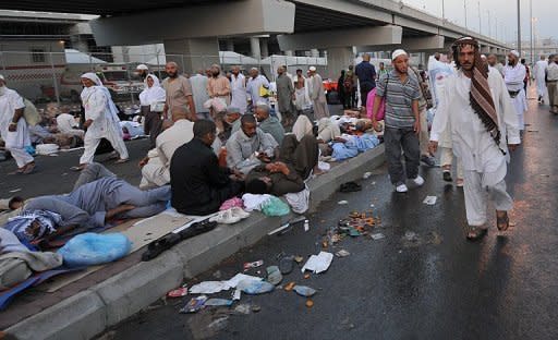 Muslim pilgrims wait in the street for their turn to take part in the "Jamarat" ritual, or the the stoning of Satan, by throwing pebbles at pillars in Mina near the holy city of Mecca