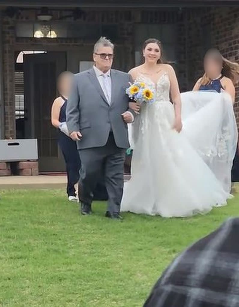 Mistique Morris is escorted down the aisle by her grandfather. KennedyNews/xxshadowslightxx