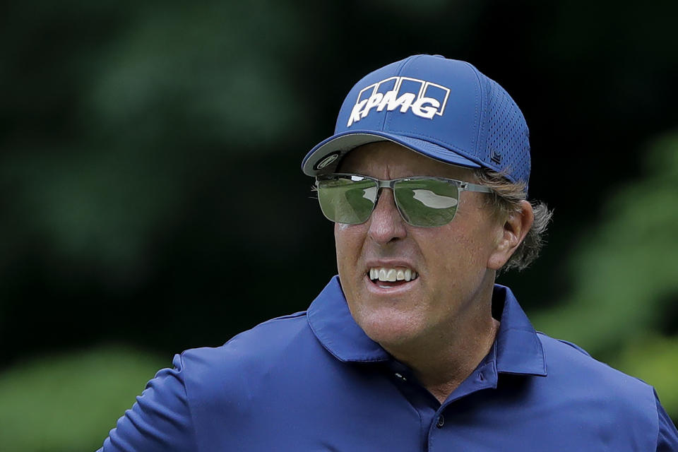 Phil Mickelson looks on after putting on the 14th green during the second round of the Travelers Championship golf tournament at TPC River Highlands, Friday, June 26, 2020, in Cromwell, Conn. (AP Photo/Frank Franklin II)