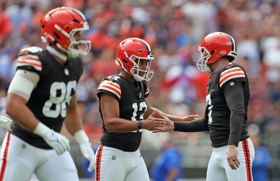 Cleveland Browns holder Corey Bojorquez (13) celebrates with kicker Dustin Hopkins (7) during the first half against the New York Giants on Sunday in Cleveland.