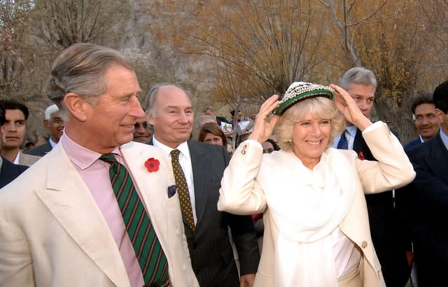 The Prince of Wales and Camilla, the Duchess of Cornwall, meet villagers of Nansoq in northern Pakistan (John Stillwell/PA)