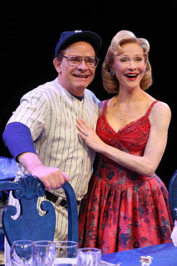 This image released by Polk & Co. shows Peter Scolari, left, and his wife, actress Tracy Shayne, portraying baseball legend Yogi Berra and his wife Carmen Berra in a scene from the play, "Bronx Bombers," which examines the rich history of the New York Yankees. (AP Photo/Polk & Co., Joan Marcus)