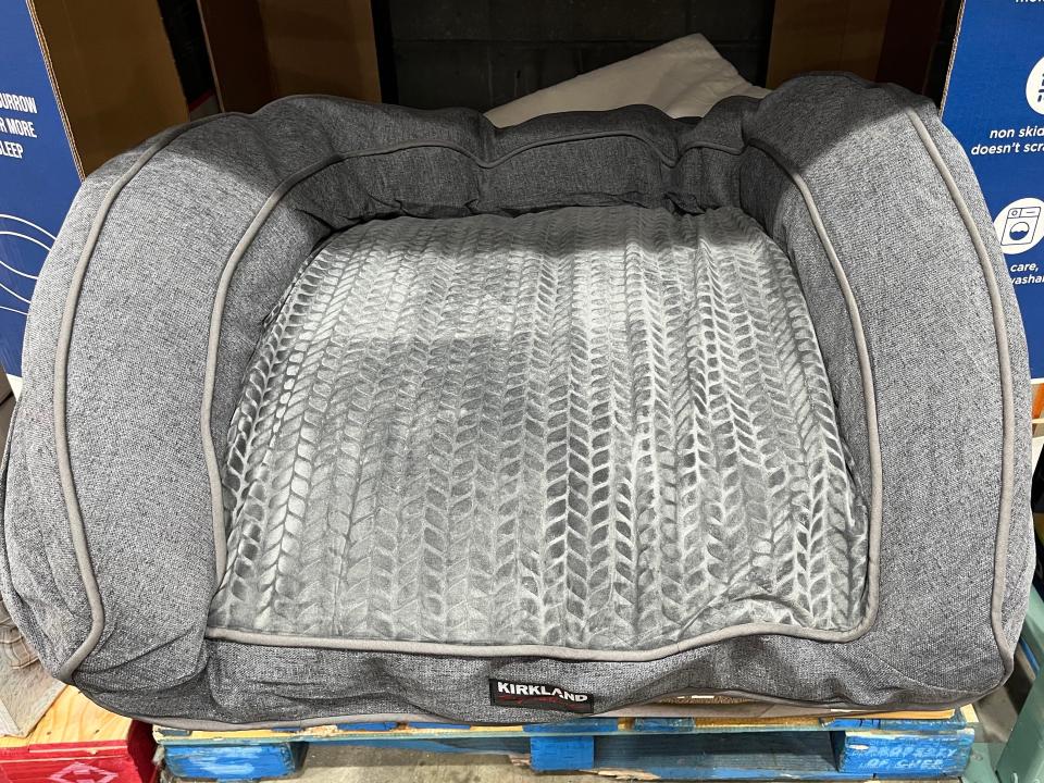 gray Dog bed in blue box at costco