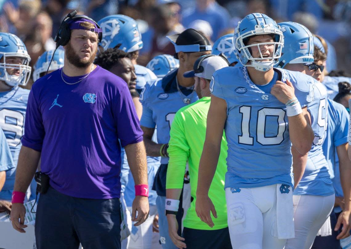 North Carolina quarterback Drake Maye (10) holds his left shoulder after taking a hit in the first quarter against Minnesota on Saturday, September 16, 2023 at Kenan Stadium in Chapel Hill N.C.