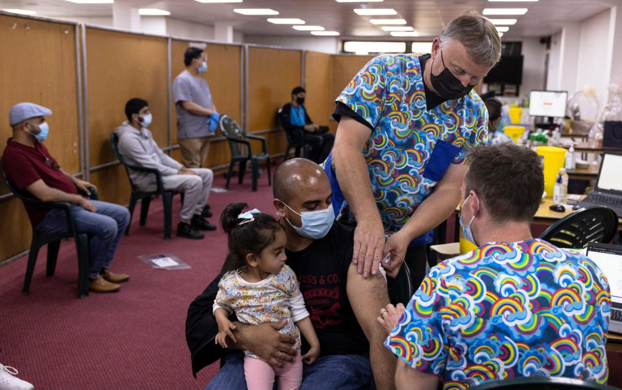 Members of the public wait to receive doses of the AstraZeneca vaccine in Southfield, south London, earlier this month - Dan Kitwood/ Getty Images Europe