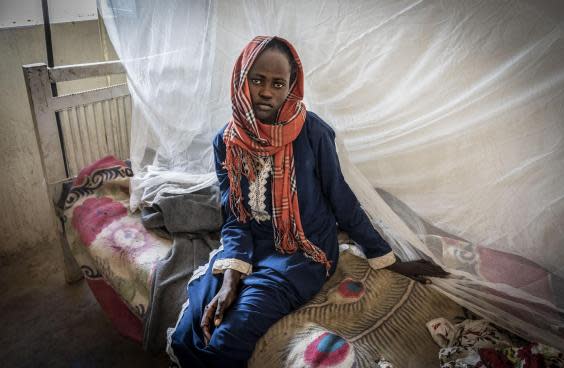 Akram, 14, is treated for malaria in Zamzam camp amid an ‘unprecedented’ outbreak of the disease in north Darfur (Bel Trew)