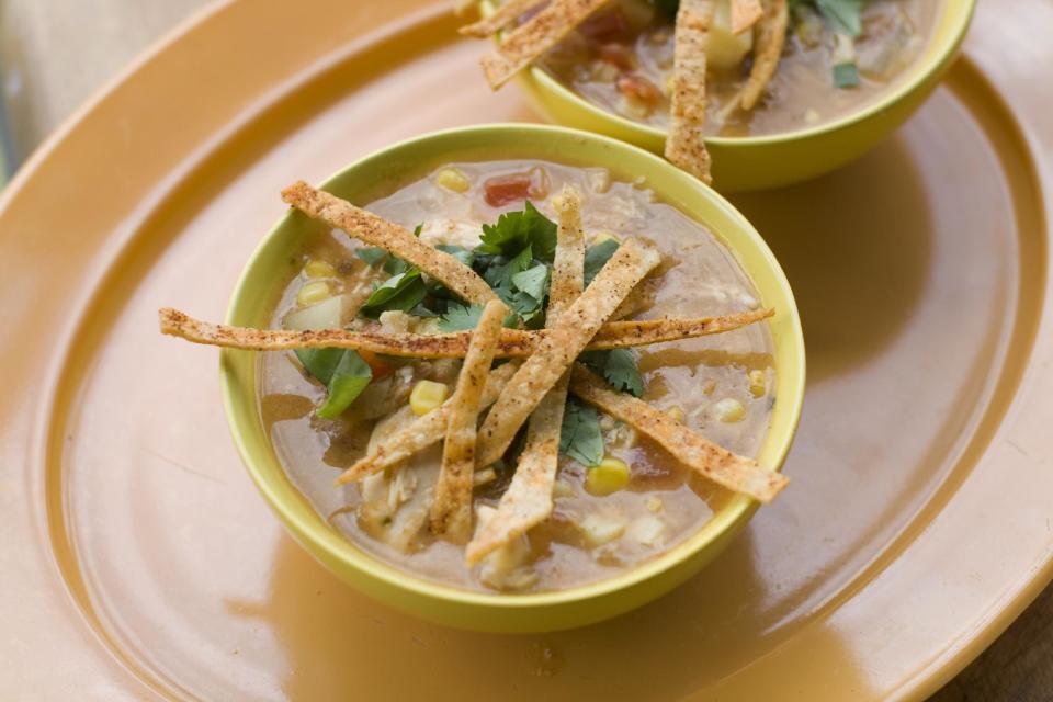 In this image taken on July 8, 2013, bowls of southwestern corn and chicken chowder with tortilla crisps are shown in Concord, N.H. (AP Photo/Matthew Mead)