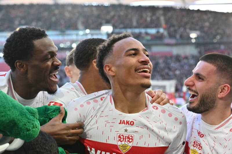 (L-R) Stuttgart's Dan-Axel Zagadou, Jamie Leweling and Deniz Undav celebrate their side's third goal of the game during the German Bundesliga soccer match between VfB Stuttgart and RB Leipzig at MHPArena. Jan-Philipp Strobel/dpa