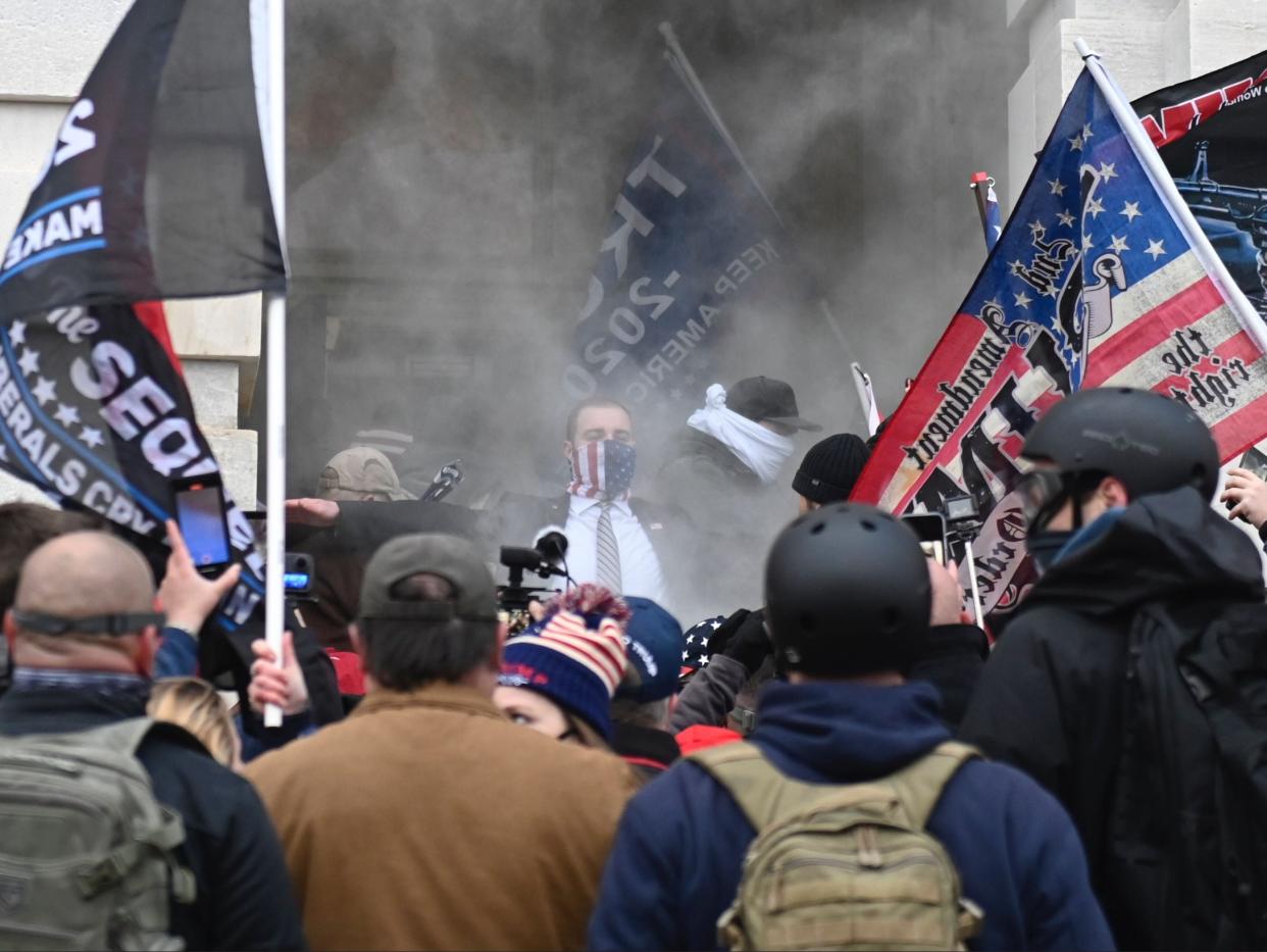 <p>Donald Trump supporters clash with police outside the US Capitol </p> (AFP)