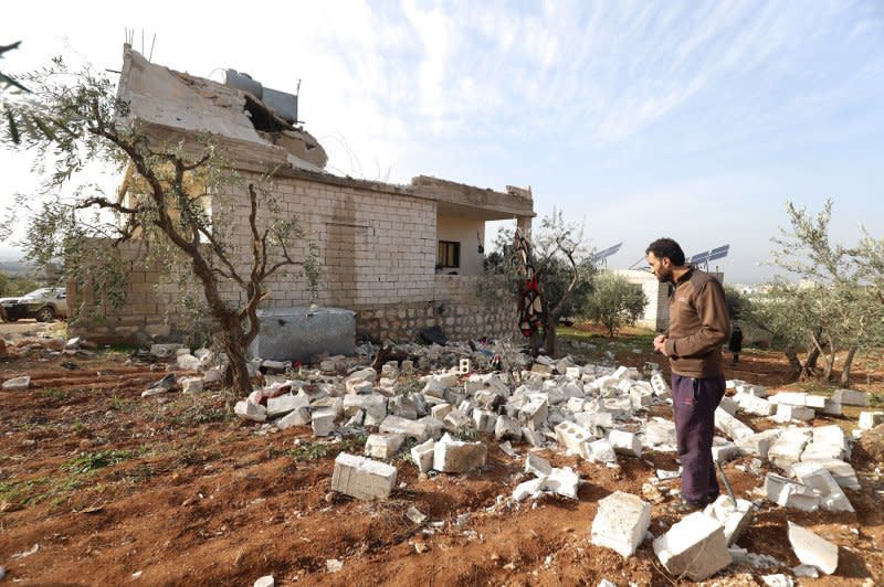 People check a destroyed house after an operation by the U.S. military in the Syrian village of Atmeh, in Idlib province, Syria, on February. 3, 2022. File Photo by Abdulaziz KETAZ/UPI