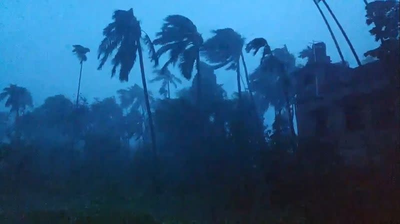 Social media video grab of trees being battered by severe winds from Cyclone Amphan in Kolkata, West Bengal