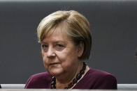 Chancellor Abgela Merkel sits on the visitors tribune as she attends the constituent session of German parliament at the Reichstag building in Berlin, Tuesday, Oct. 26, 2021. Following the national elections on September 26th, the parliament Bundestag meet for the constituent parliamentary session. (AP Photo/Markus Schreiber)