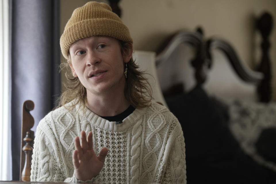 Wyatt Kent, who goes by the stage name of Potted Plant, speaks during an interview on Monday, June 5, 2023, in Colorado Springs, Colo. “Someone’s gone that can never be brought back through the justice system,” says Kent, who was celebrating his 23rd birthday in Club Q when Anderson Lee Aldrich opened fire, gunning down Kent’s fiancé, Daniel Aston, who was working behind the bar. “We are all still missing a lot, a partner, a son, a daughter, a best friend.” (AP Photo/David Zalubowski)