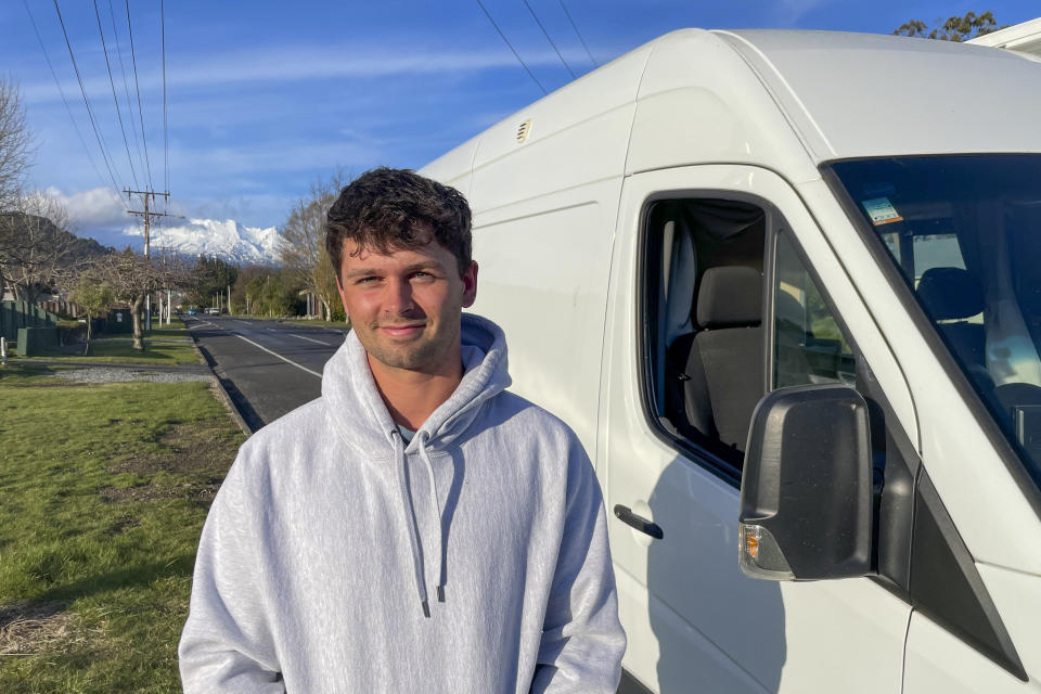 Sam Yates, who was laid off in mid-August from his dream job as a ski instructor at Tūroa, poses in Ohakune at the base of Mt. Ruapehu, New Zealand on Sept. 20, 2022. A disastrous snow season has left two of New Zealand's largest ski fields on the brink of bankruptcy, with climate change appearing to play a significant role. (AP Photo/Nick Perry)