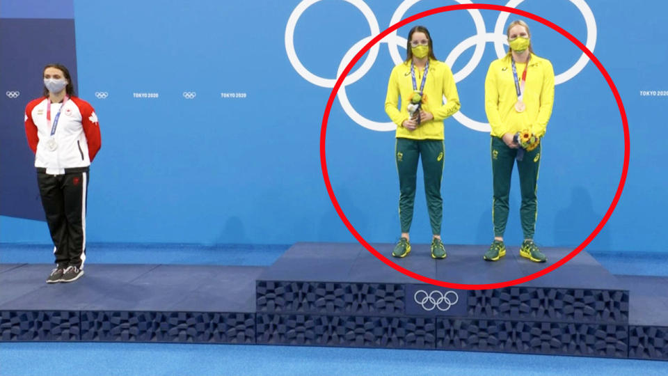 Kaylee McKeown, pictured here after she invited Emily Seebohm onto the top podium for the national anthem. 