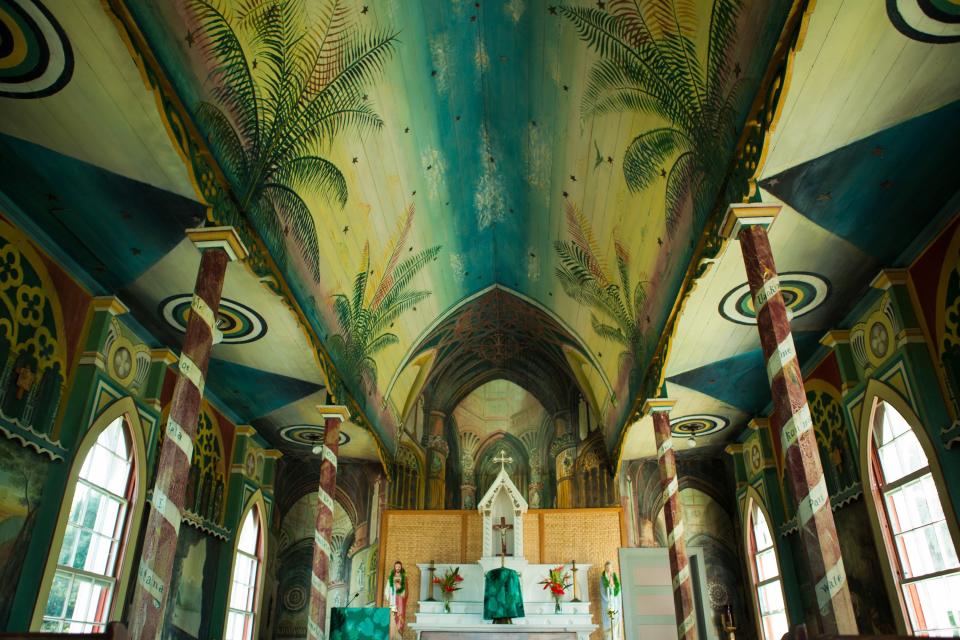 St. Benedict’s (Captain Cook, Big Island, Hawaii)
Past its traditional Spanish Gothic exterior, St. Benedict’s—framed by lush tropical landscaping—is a tapestry of murals, frescos and folk art on the inside. Built by a priest in 1899 who also wanted to add colorful accents, he used the art to teach spiritual lessons to illiterate Hawaiians.