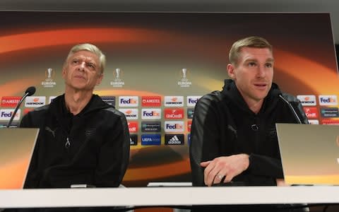 Arsenal manager Arsene Wenger and captain Per Mertesacker  - Credit: GETTY IMAGES