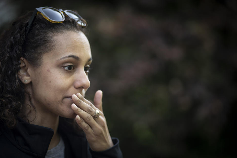 Catherine Manson holds back her tears while recounting a time when her son, Carter Manson, suffered an asthma attack at a friend's birthday party, in Hartford, Conn., on Wednesday, May 25, 2022. "He just kept saying 'I can't breathe, I can't breathe,''' she remembers. "I picked him up and told him it was OK and to just breathe. Just breathe." (AP Photo/Wong Maye-E)