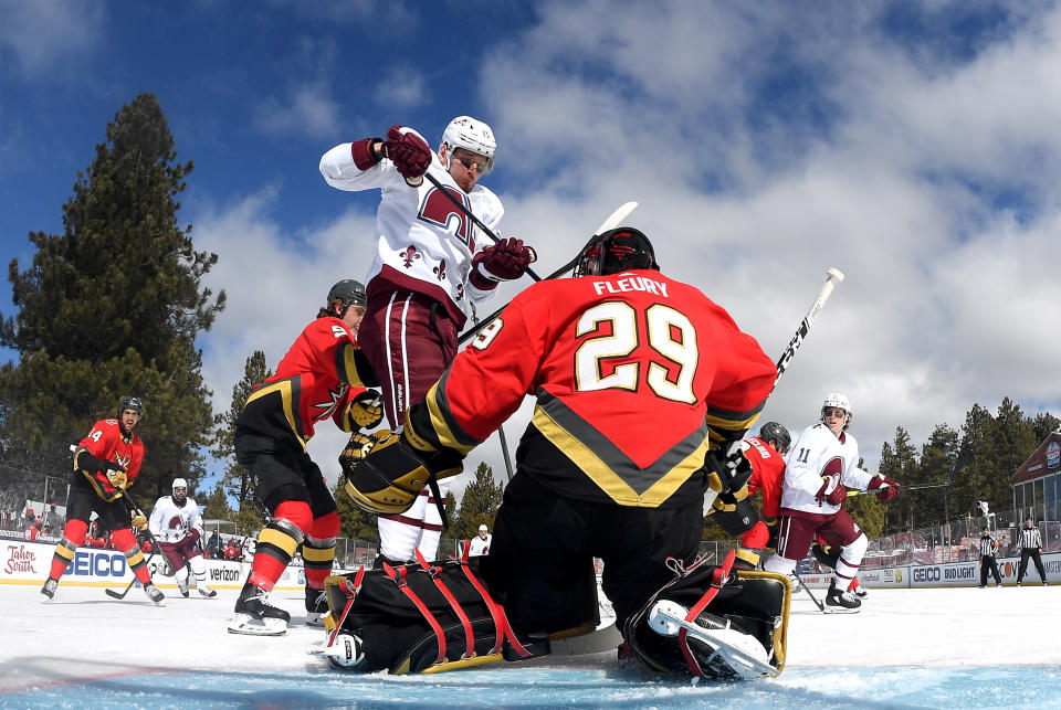 <p>Valeri Nichushkin #13 of the Colorado Avalanche jumps in front of goaltender Marc-Andre Fleury #29 of the Vegas Golden Knights who makes a save during the first period of the 2021 Bridgestone NHL Outdoors Saturday on the 18th fairway of the Edgewood Tahoe Resort, at the south shore of Lake Tahoe on February 20, 2021 in Stateline, Nevada. (Photo by Brian Babineau/NHLI via Getty Images)</p> 