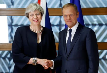 British Prime Minister Theresa May and European Council President Donald Tusk pose during a EU leaders summit in Brussels, Belgium June 22, 2017. REUTERS/Francois Lenoir