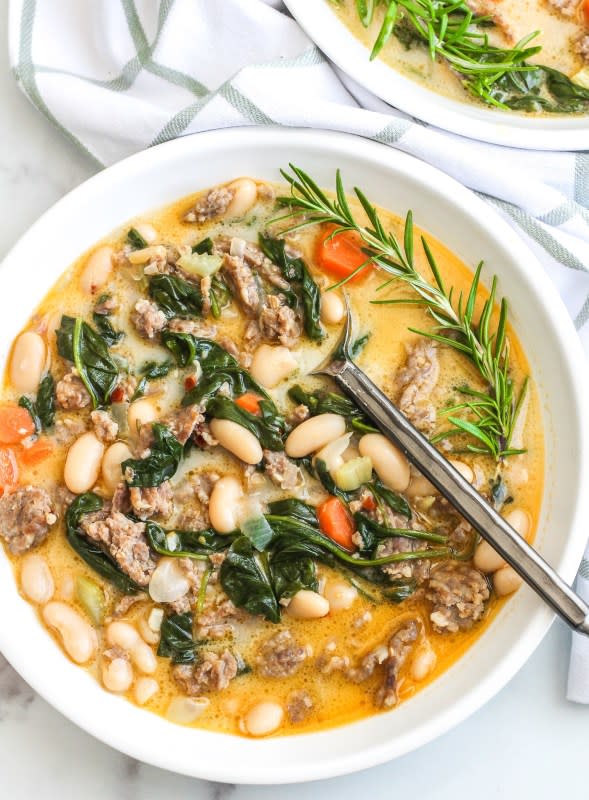 <p>The Bettered Blondie</p><p>This Italian white bean soup is so simple to make, but has so many layers of flavor. The beans are so rich and buttery and the sausage adds some spice. It is a perfect dish for a chilly night!</p><p><strong>Get the recipe: <a href="https://thebetteredblondie.com/italian-white-bean-soup/" rel="nofollow noopener" target="_blank" data-ylk="slk:Italian White Bean Soup;elm:context_link;itc:0;sec:content-canvas" class="link rapid-noclick-resp"><em>Italian White Bean Soup</em></a></strong></p>